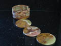 3 coasters and a holder